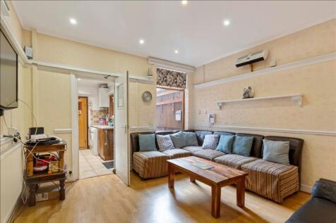 A spacious and inviting living room adorned wit...