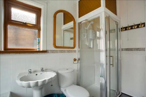 Bright and modern bathroom featuring a stylish ...