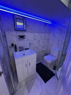 Modern and well-maintained bathroom featuring a...
