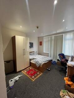 Well-lit double bedroom with a comfy bed, fitte...