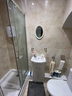 Well-presented modern bathroom with tiled walls...