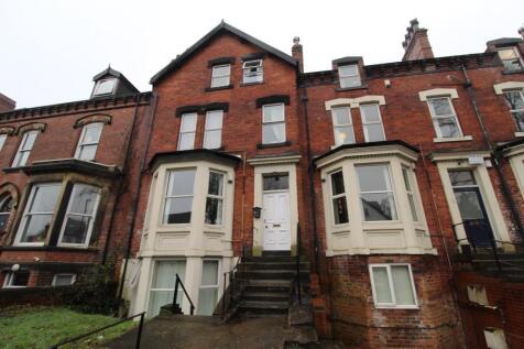 Red-brick Victorian terraced house with bay win...