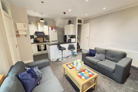 A contemporary and well-maintained living room ...