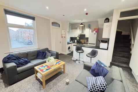 Bright and welcoming living room featuring a la...