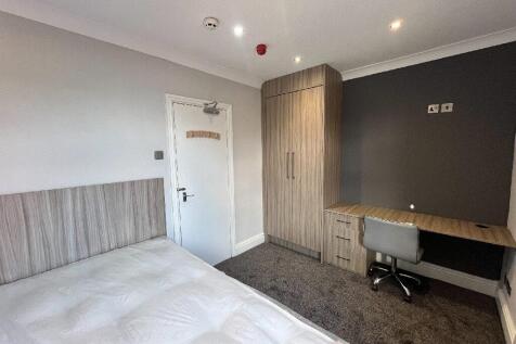 A modern, well-maintained bedroom featuring nat...