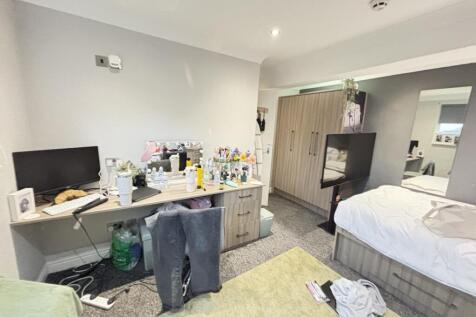 Bright and well-maintained bedroom featuring a ...