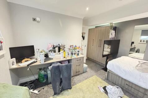 A bright and inviting living room with plenty o...