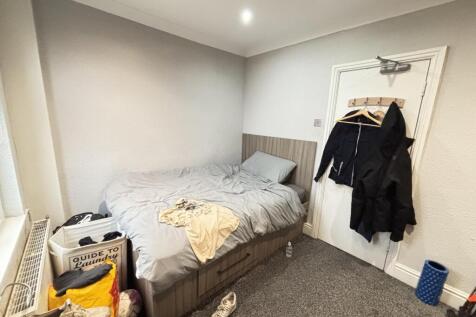 A functional double bedroom with a comfortable ...