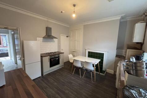 A bright and modern living room featuring a coz...