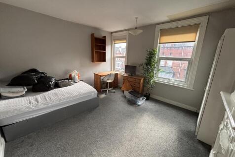 Bright and welcoming living room with large win...