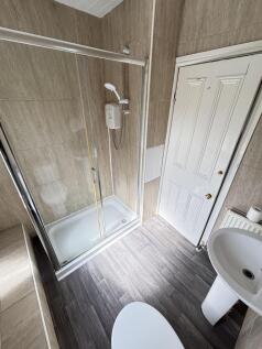 A clean and well-maintained bathroom featuring ...
