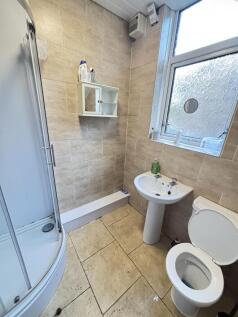A clean, well-maintained bathroom with neutral ...
