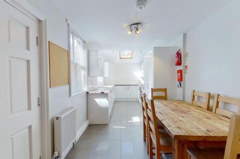 Bright, modern open-plan kitchen and dining are...