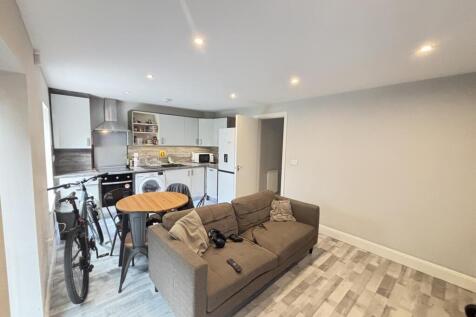 A bright and modern living room featuring a com...