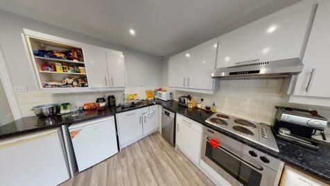 A modern, well-maintained kitchen featuring amp...