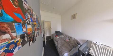 A spacious and well-maintained master bedroom f...