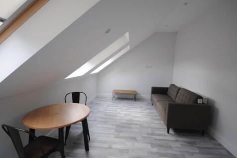 A bright and modern living room featuring a com...