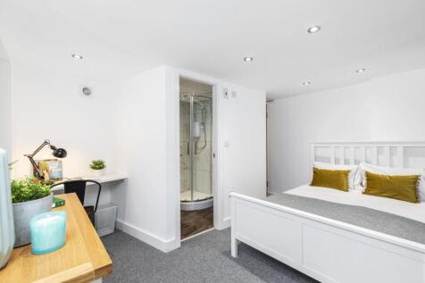 Bright, freshly decorated bedroom with a white ...