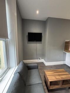 A modern and bright living room featuring a com...