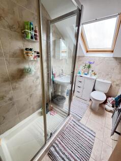 A bright and well-maintained bathroom featuring...