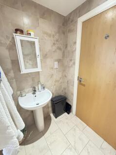 A clean, well-maintained bathroom featuring a p...