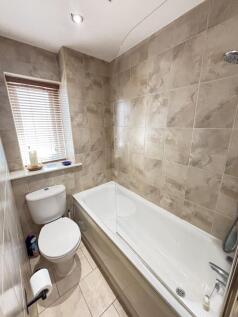 A clean, well-maintained bathroom featuring a s...