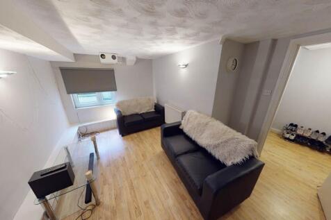 A spacious and inviting living room with ample ...