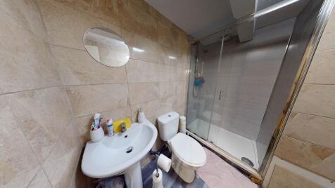 A well-maintained bathroom featuring a bathtub,...