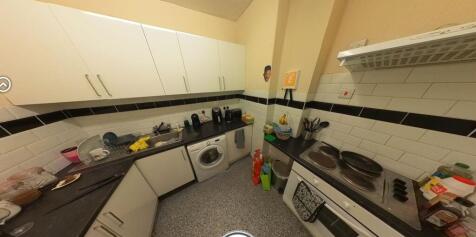 A well-equipped kitchen with modern appliances ...