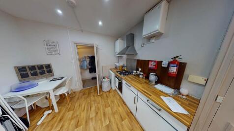 Bright and functional kitchen area featuring am...