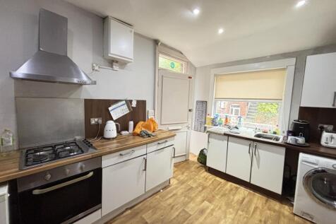 Bright and well-maintained kitchen with ample n...