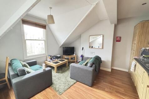 Bright and welcoming living room with modern fu...