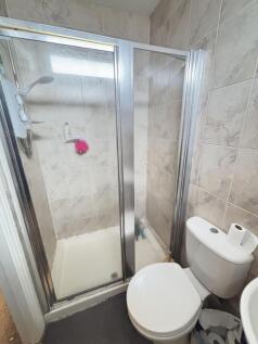 A clean, well-maintained bathroom featuring a s...