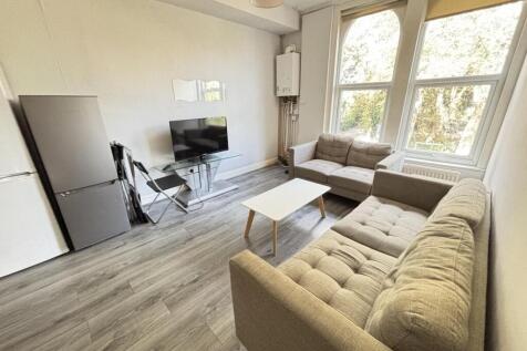 A bright and spacious living room featuring mod...