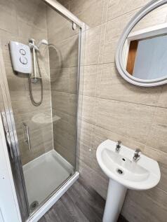 A clean and well-maintained bathroom featuring ...