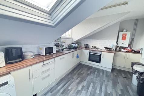 A bright, modern kitchen with ample natural lig...