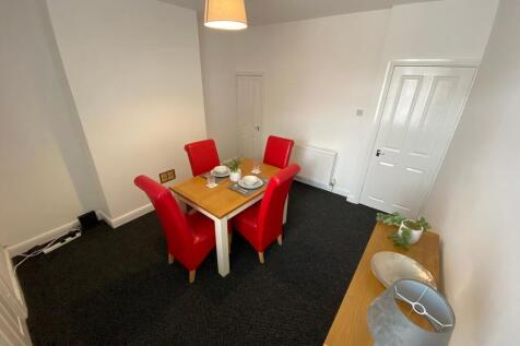 Bright, freshly painted dining/living room with...