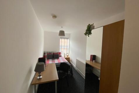 Brightly furnished single bedroom with a double...
