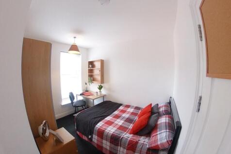 Bright, tidy double bedroom with a patterned re...