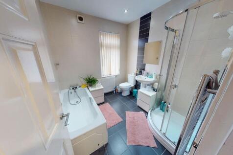 Bright and well-maintained bathroom with a spac...