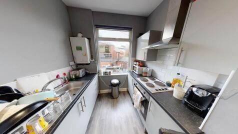 Bright and modern kitchen with ample counter sp...