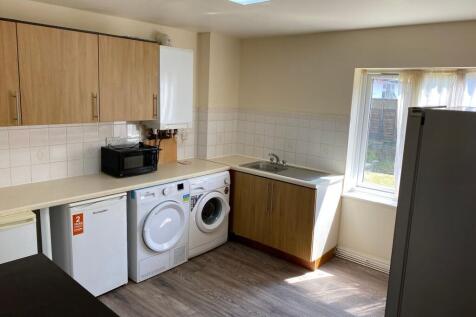 Bright kitchen with fitted cabinets, integrated...