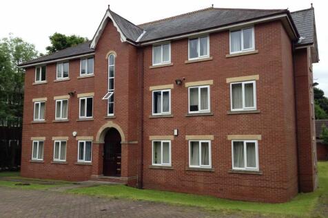 A charming brick building with a well-maintaine...