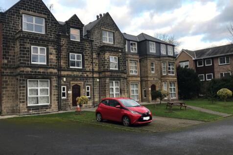 Exterior view of a historic stone building with...
