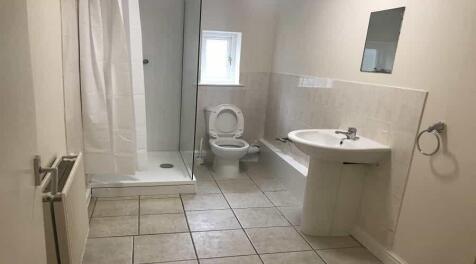 A clean and well-maintained bathroom with a sho...