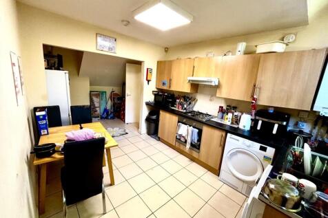A practical and well-used kitchen featuring woo...
