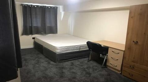 A well-maintained single bedroom featuring a co...