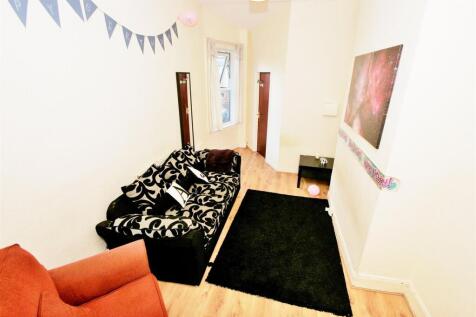 Bright and welcoming living room featuring a st...