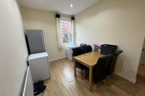 A bright, modern living room featuring a window...