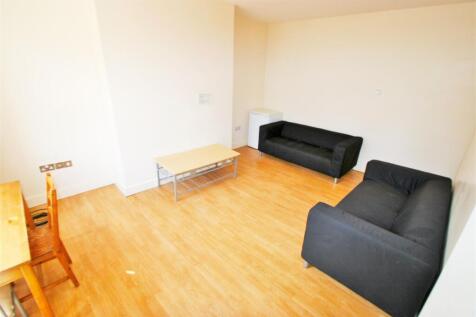 Bright and welcoming living room with ample nat...